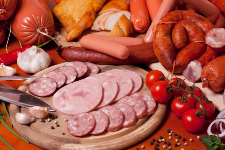 Close up photo of different types of sausages ready to be cooked.
