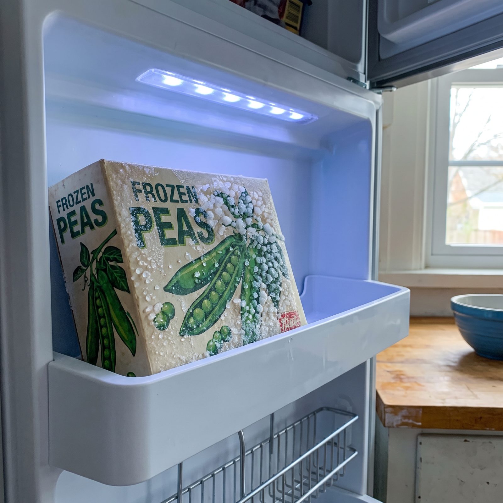 A Box of Frozen Peas, Beaded With Frost