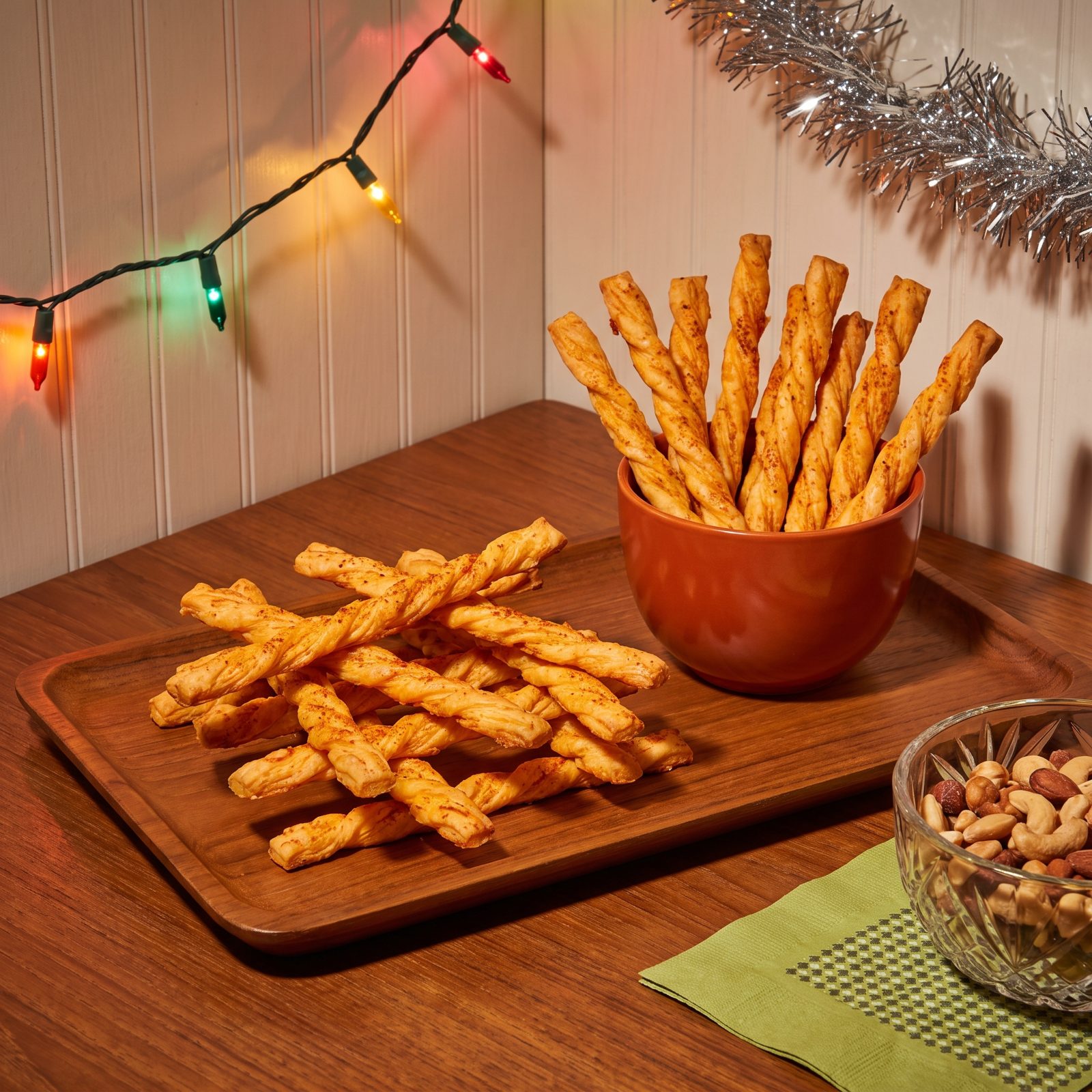 Cheddar Cheese Straws Stacked Like Kindling on the Teak Tray