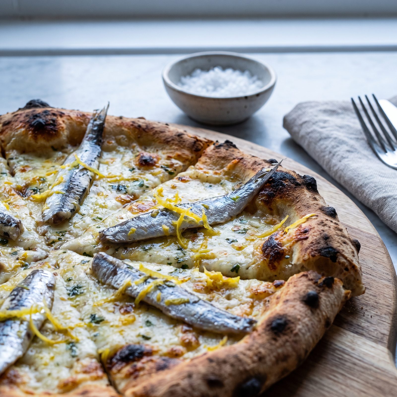 Anchovy Pizza Balanced With Bright Lemon Zest