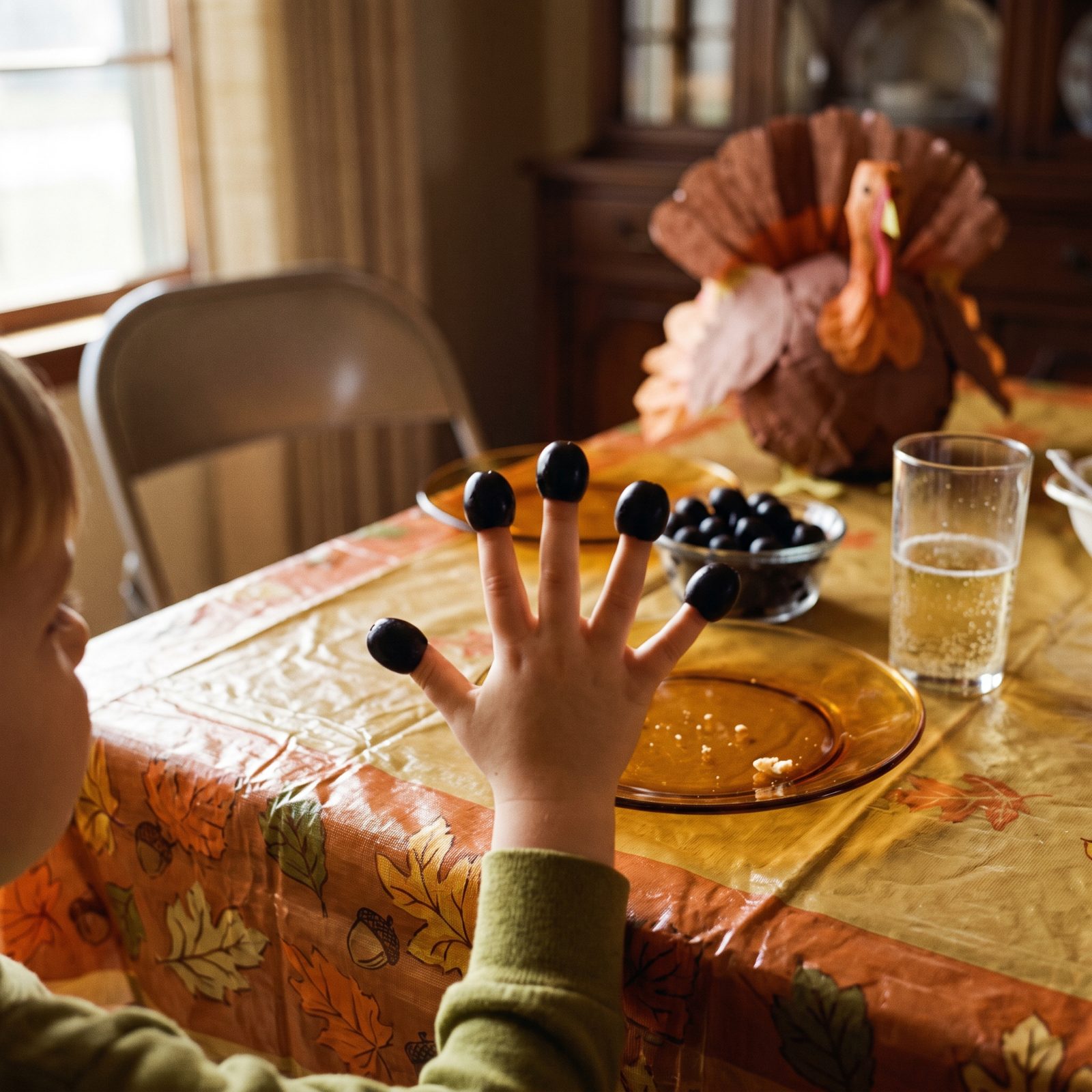 Black Olives Worn on Every Fingertip