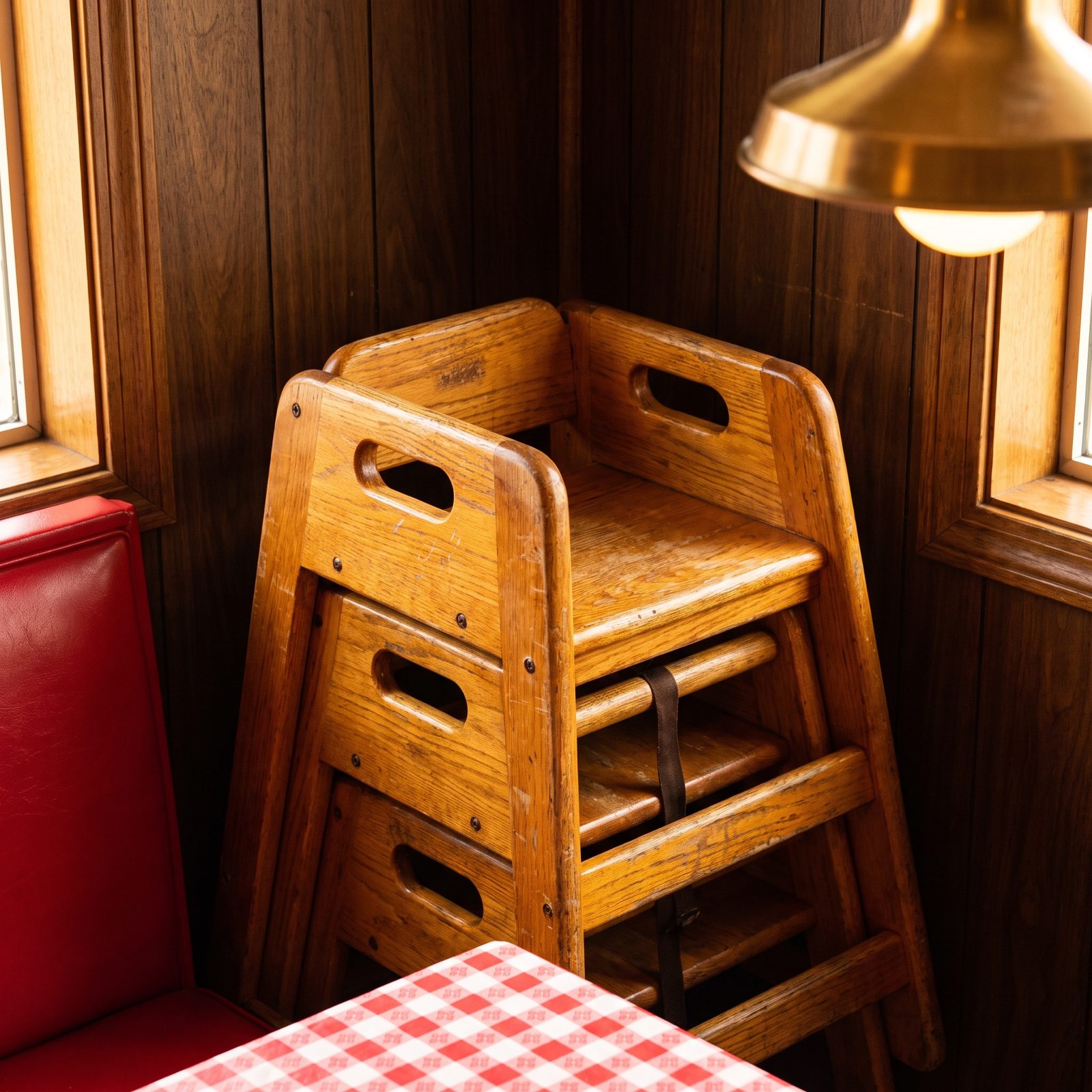 Wooden Booster Seats Stacked in a Corner